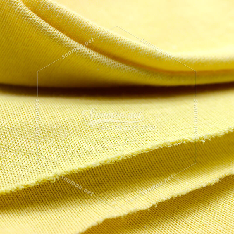 cut proof fabric, detail of Kevlar knitted fabric, yellow, made of Kevlar yarn, sligh elastic